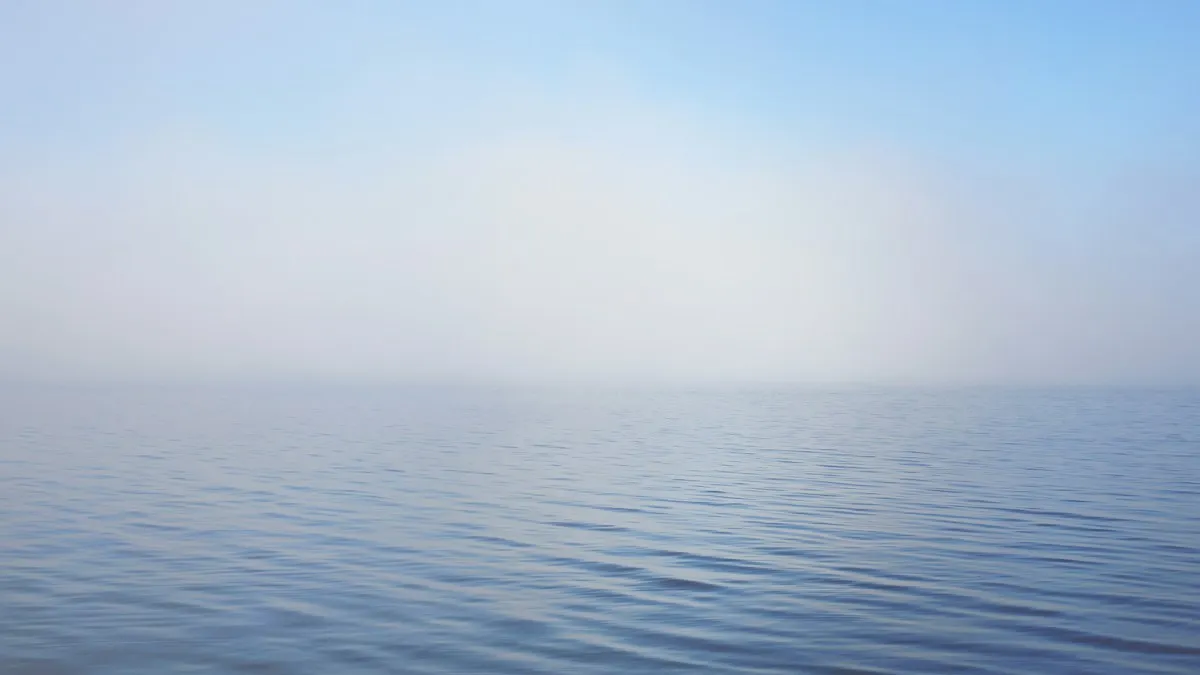 Calm blue ocean stretching to a soft horizon